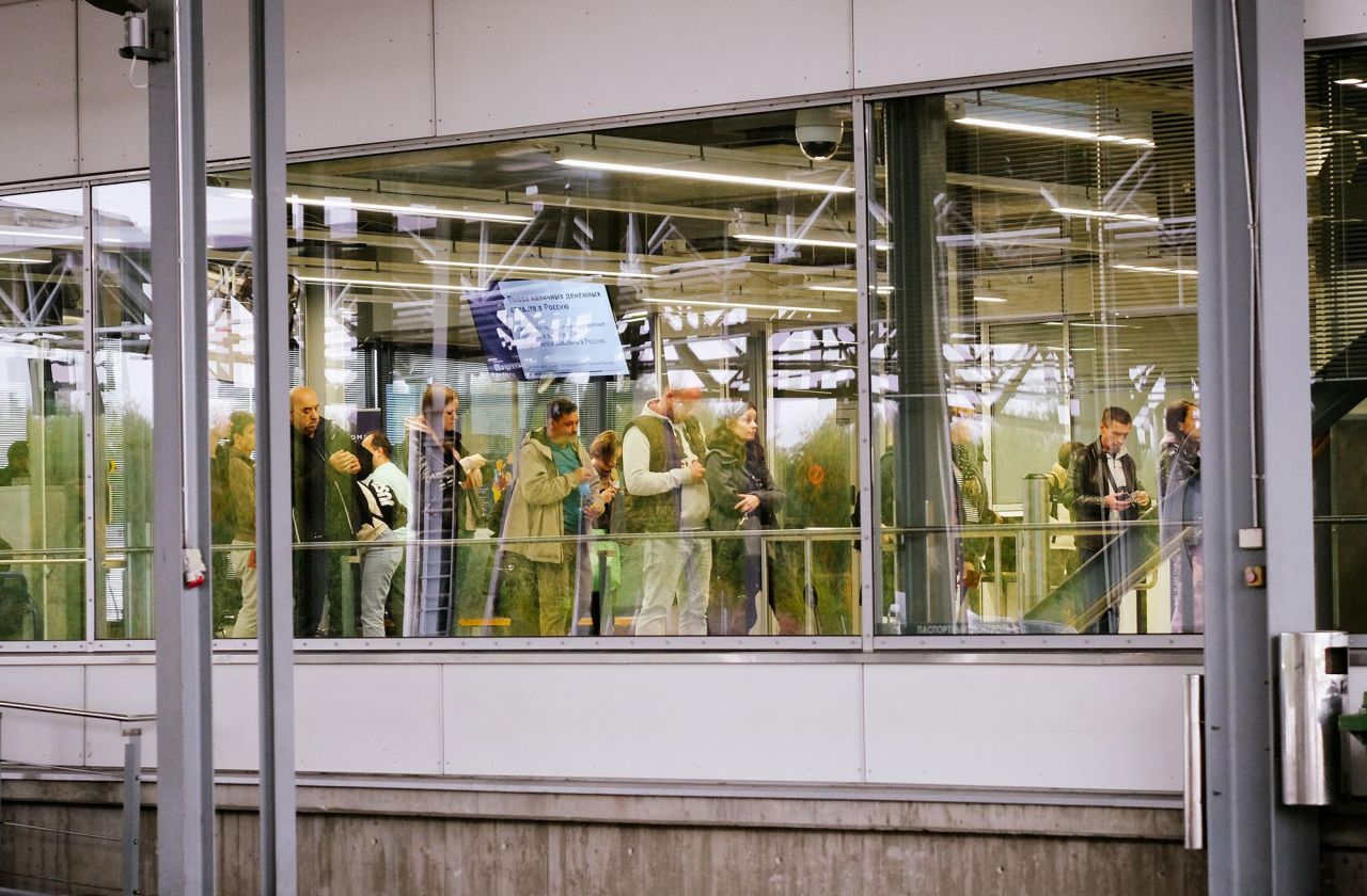 People entering Finland queue at the passport control area at the border checkpoint crossing in Vaalimaa, Finland, on the border with the Russian Federation on September 29.
