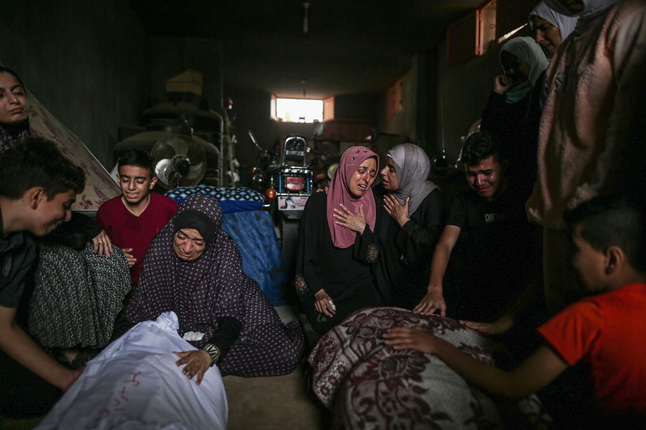 Relatives of people killed in Israeli attacks mourn during funeral prayers in Khan Younis, Gaza, on November 13.