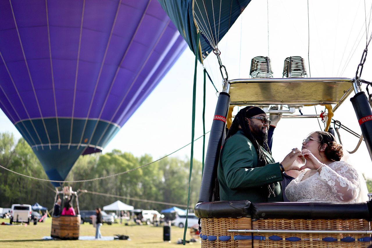 Kylee and Michael Rice prepare to take a hot air balloon ride before a planned mass wedding of over 200 couples in Russellville, Arkansas. 