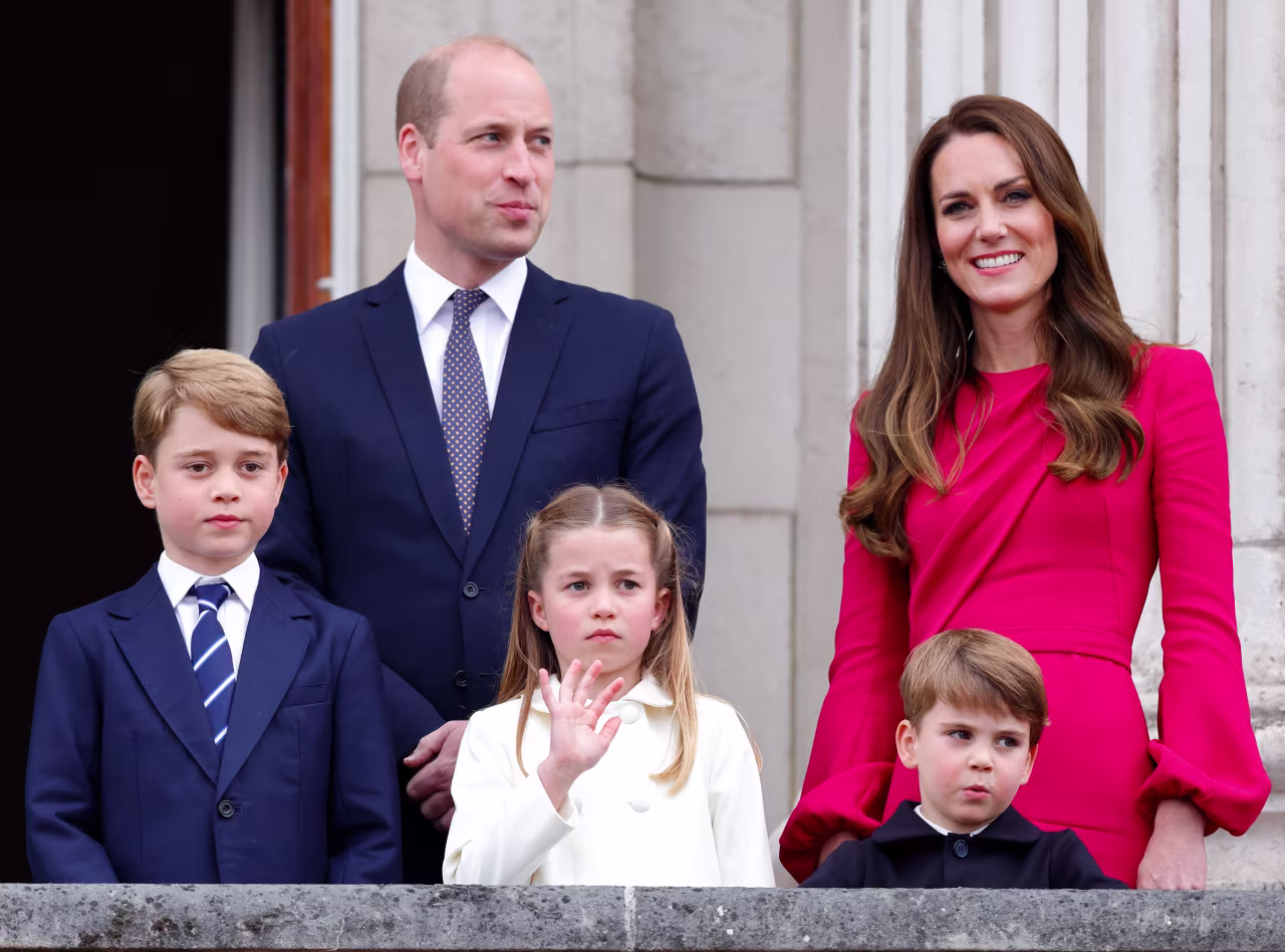 Prince William and Catherine stand together with their children on the balcony of Buckingham Palace in June.