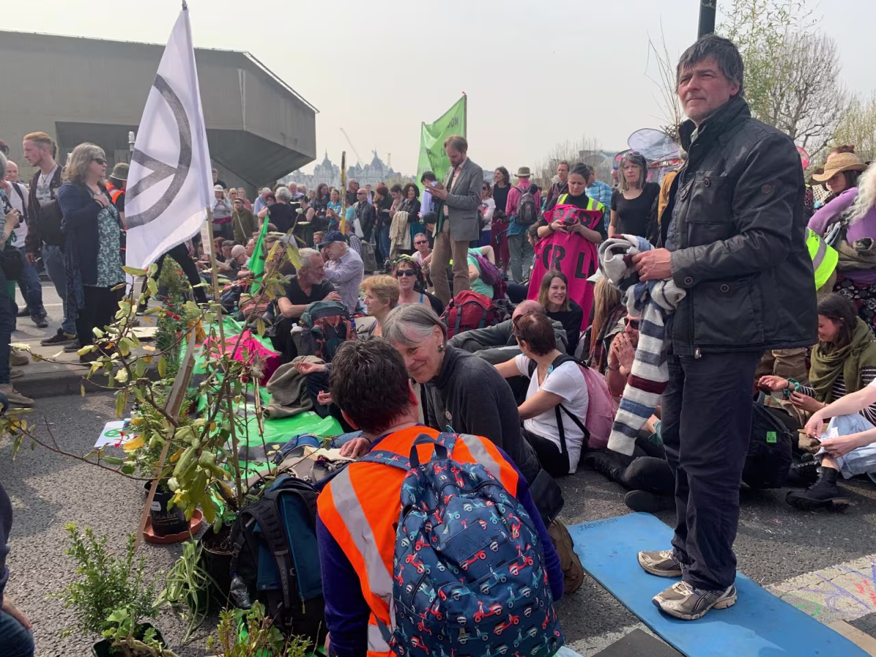 Protesters who are prepared to be arrested for taking a stand move forward on Waterloo Bridge as officers from London's Metropolitan Police approach.  