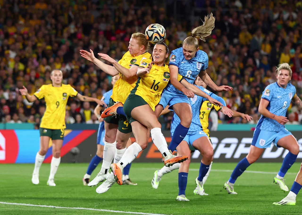 England's Georgia Stanway in action with Australia's Hayley Raso and Clare Polkinghorne during their semifinal clash at Stadium Australia in Sydney on August 16.