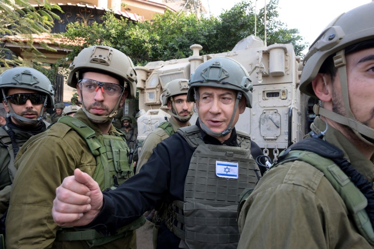 Benjamin Netanyahu receives a security briefing with commanders and soldiers in the northern Gaza Strip, on December 25.