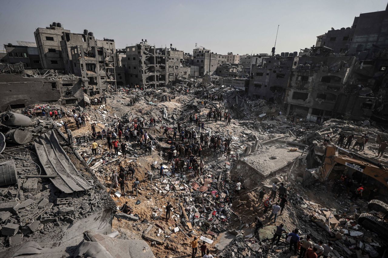 Palestinians conduct search and rescue operations after the second bombardment at Jabalya refugee camp in Gaza City on November 1. 