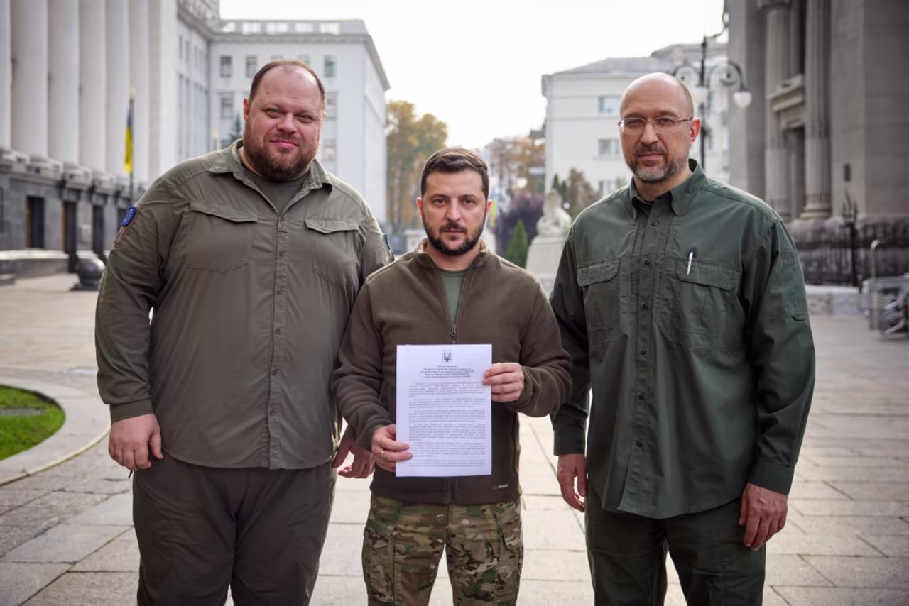 Ukrainian President Volodymyr Zelensky, center, together with Speaker of the Parliament Ruslan Stefanchuk and Prime Minister Denys Shmygal are applying “under an accelerated procedure” for Ukraine to become a member of the North Atlantic Treaty Organization.