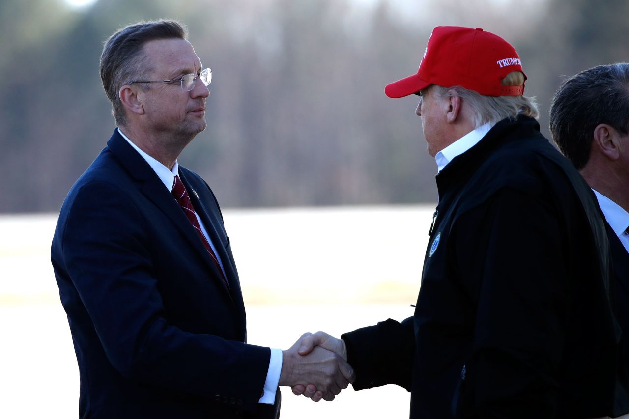 Donald Trump shakes hands with Georgia Rep. Doug Collins as he arrives at Dobbins Air Reserve Base in Marietta, Georgia on March 6. 