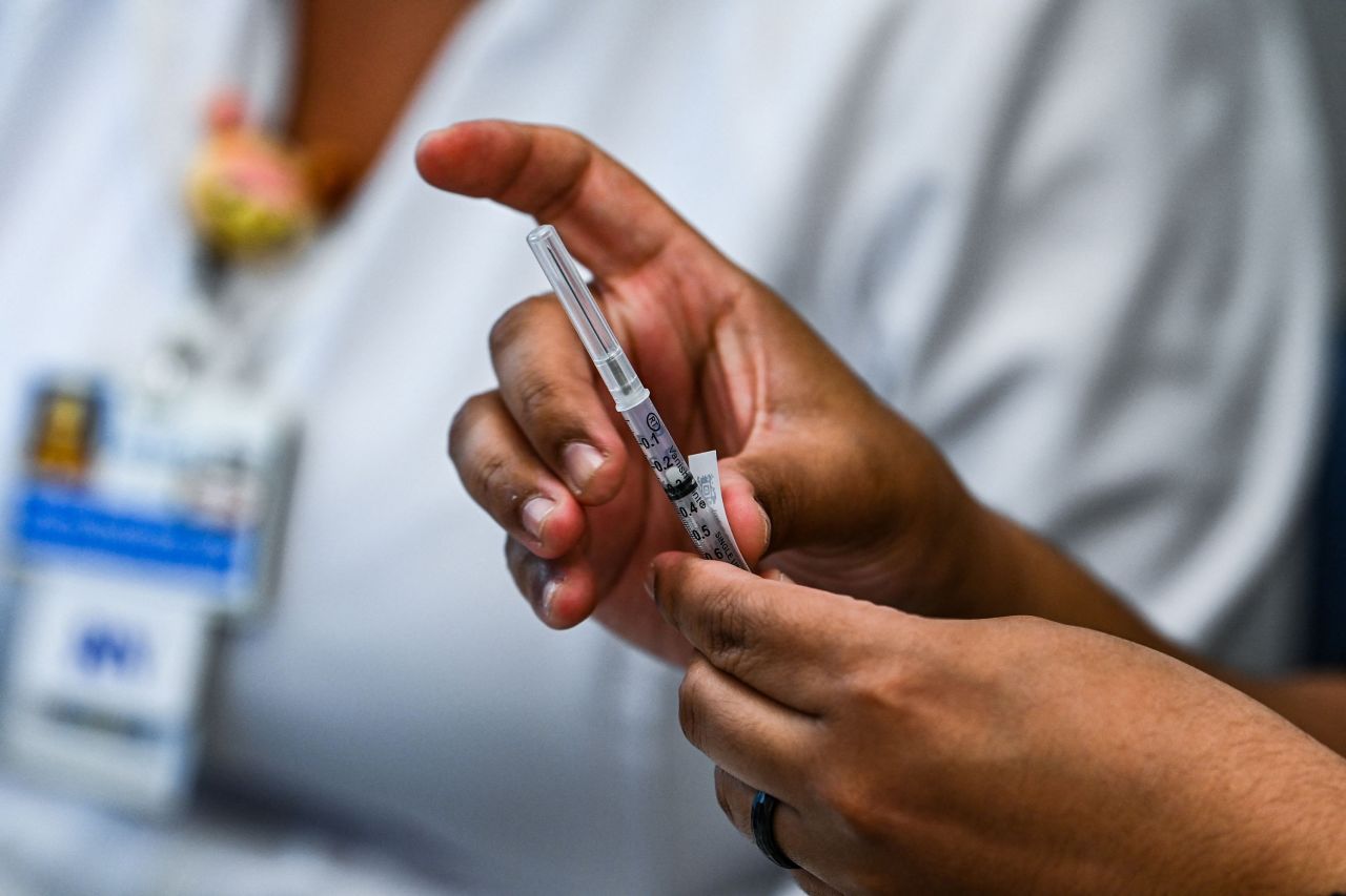 Pharmacy student Jason Rodriguez prepares Pfizer vaccines at the Christine E. Lynn Rehabilitation Center in Miami on April 15.