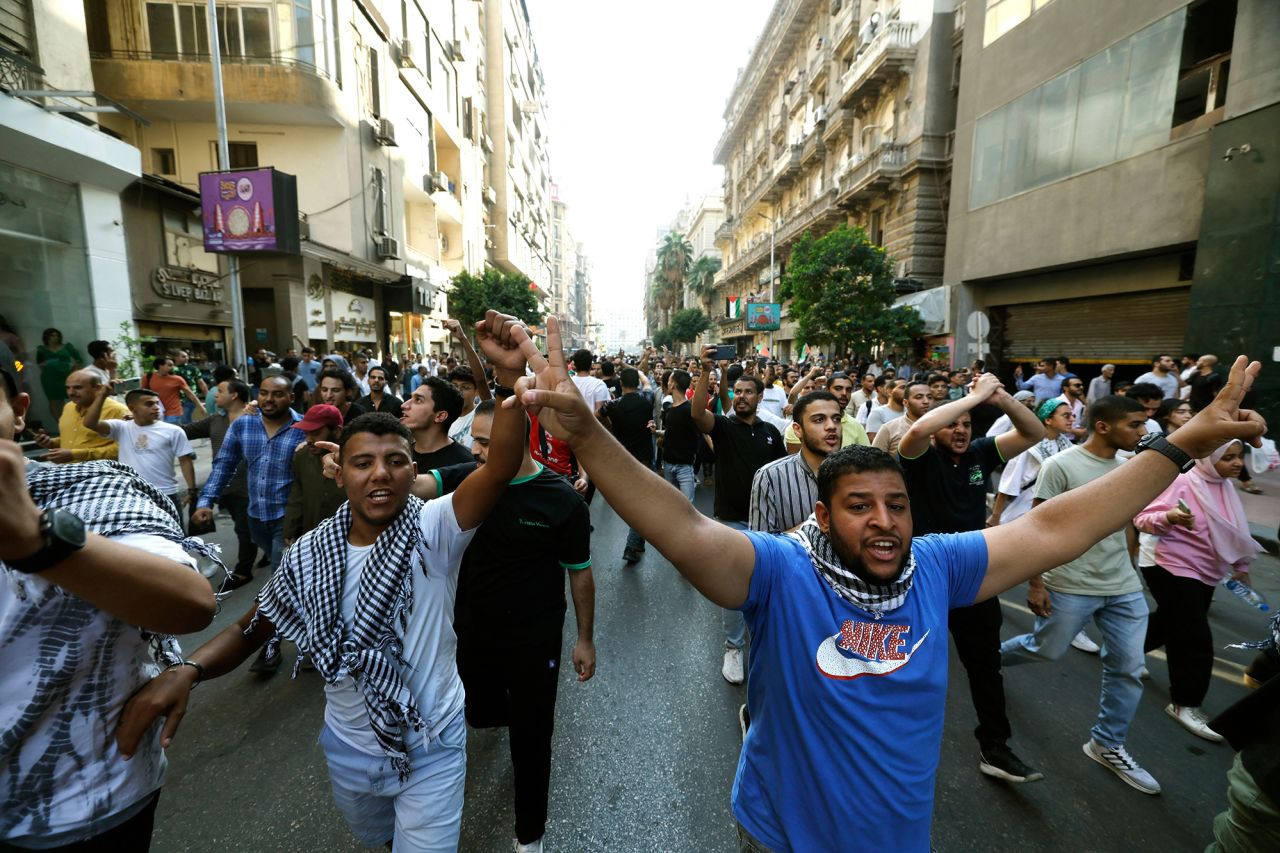 People march during a protest supporting the Palestinian people following Friday noon prayers toward Tahrir Square in Cairo, Egypt, on October 20.