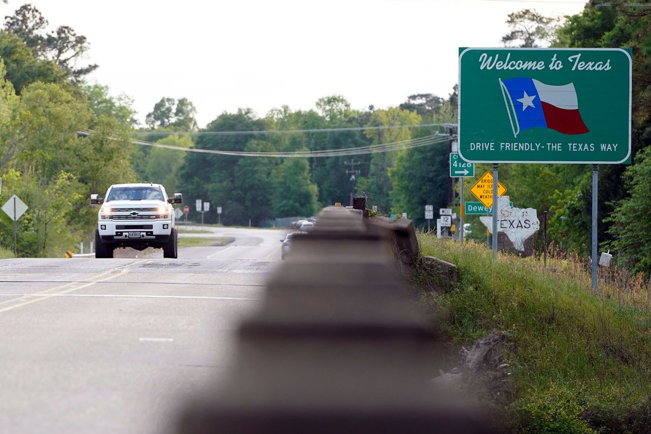 A truck dives down a road in Deweyville, Texas on Sunday, March 29.