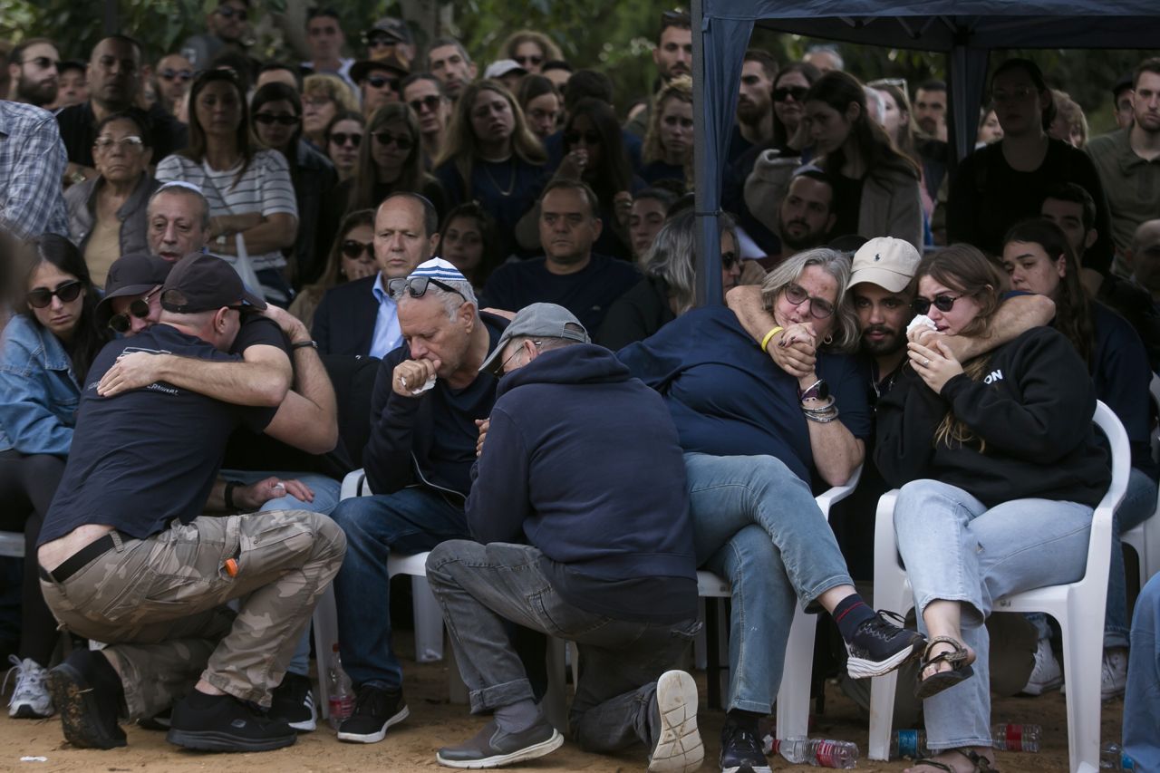 Family and friends mourn during a funeral for Alon Shamriz on December 17, 2023 in Shefayim, Israel. On Friday, the Israel Defense Forces admitted to accidentally killing Shamriz and two other Israeli hostages who had been held captive by Hamas.
