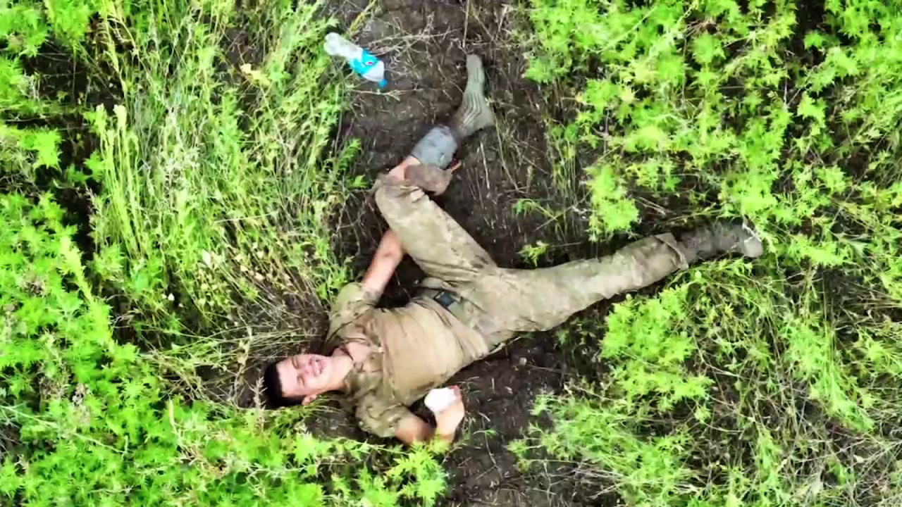 Drone footage shows wounded Ukrainian soldier, Serhiy, as he awaits rescue after being separated from his unit.