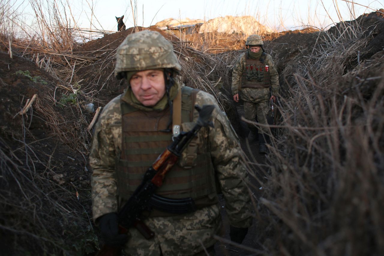 Ukrainian Military Forces servicemen walk through trenches on the front line in Donetsk region, Ukraine, on February 21. 