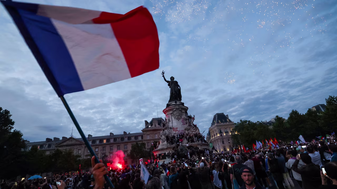 Crowds gather during an election night rally at Place de la République in Paris. 