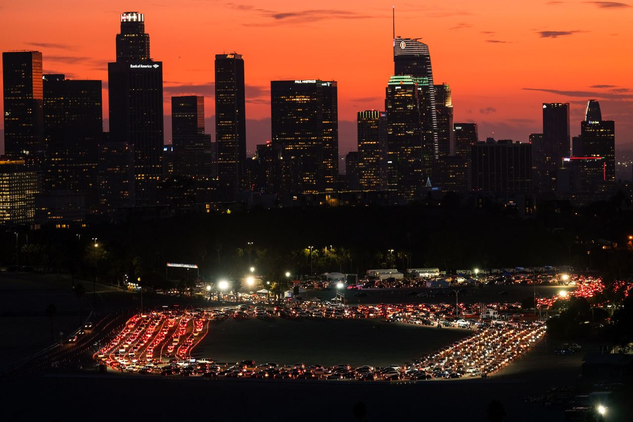 Motorists wait in lines to take a coronavirus test in a parking lot at Dodger Stadium on January 4 in Los Angeles. 