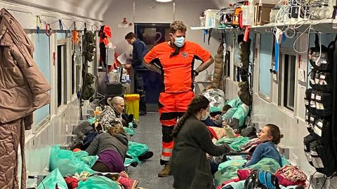 Medical staff keep watch over the terminally on the way to Poland— not to save them but to allow them to die with dignity knowing they are now safe.