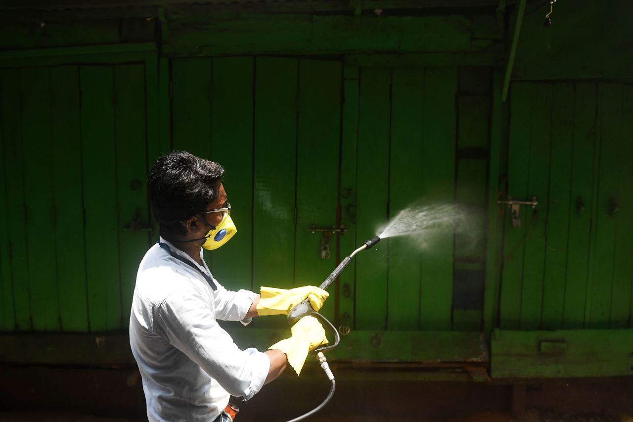 A municipal worker sprays disinfectant in Kolkata, India, on April 12.