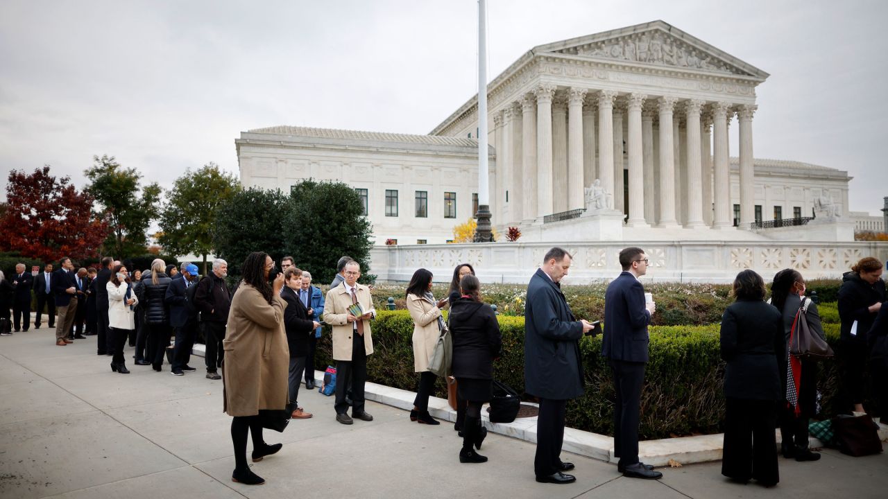 People stand in line in front of the Supreme Court for an opportunity to hear oral arguments on Monday.