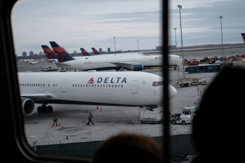 Delta airplanes sit on the tarmac at John F. Kennedy Airport in New York City. 