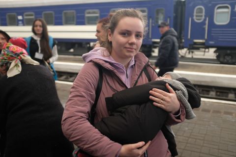 Katya Yatsun and her child in Lviv's train station, on Friday.