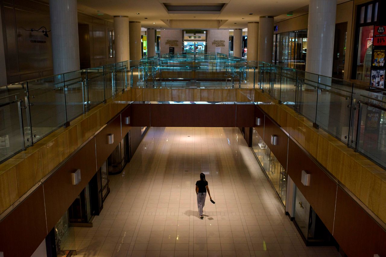 A lone shopper walks around The Galleria shopping center on May 1, in Houston, Texas. 