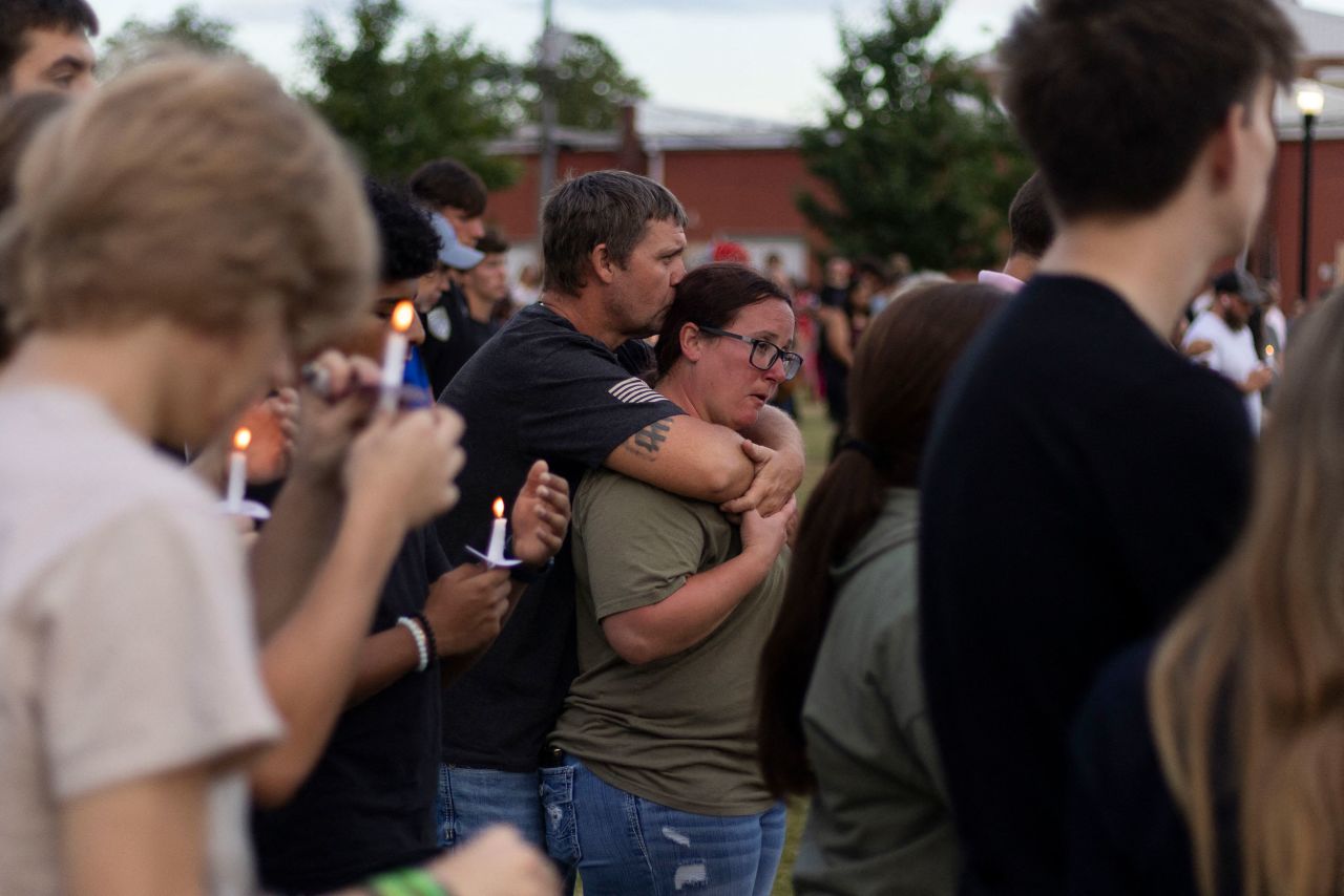 A couple embraces during a vigil for the Apalachee High School shooting in Winder, Georgia, on Wednesday, September 4.