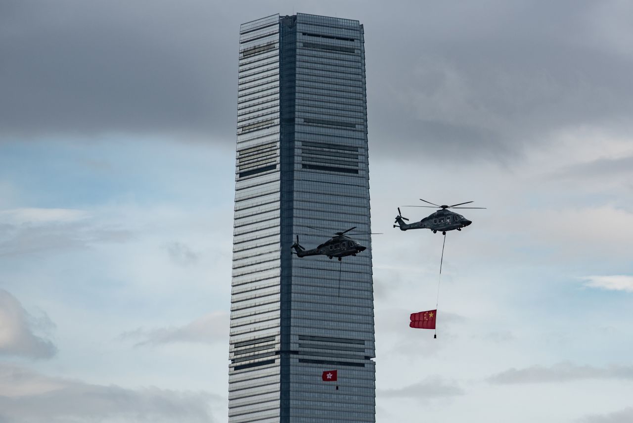 Helicopters fly across Victoria Harbour carrying Hong Kong and Chinese flags to mark the 22nd anniversary of the city's handover from Britain to China on July 1.