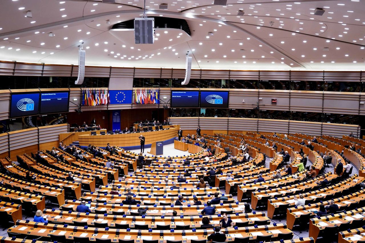 Members of the EU Parliament arrive at the beginning of a plenary session in Brussels on Tuesday, which has been reduced to a single day due to the coronavirus outbreak.