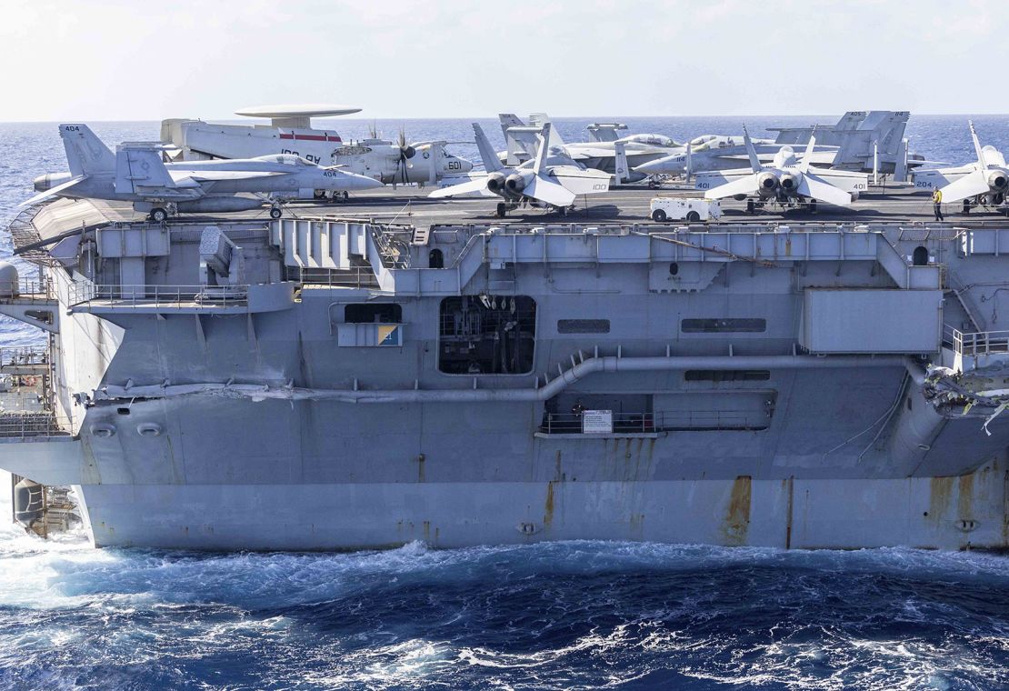 Exterior damage to the aircraft carrier USS Harry S. Truman as seen from a helicopter following a collision with a merchant vessel Besiktas-M off Egypt on February 12.