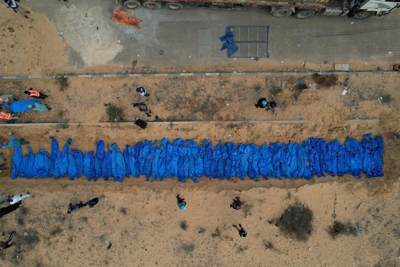 An aerial view shows a mass burial of Palestinians who were killed in Israeli attacks in Khan Younis, Gaza, on November 22. 