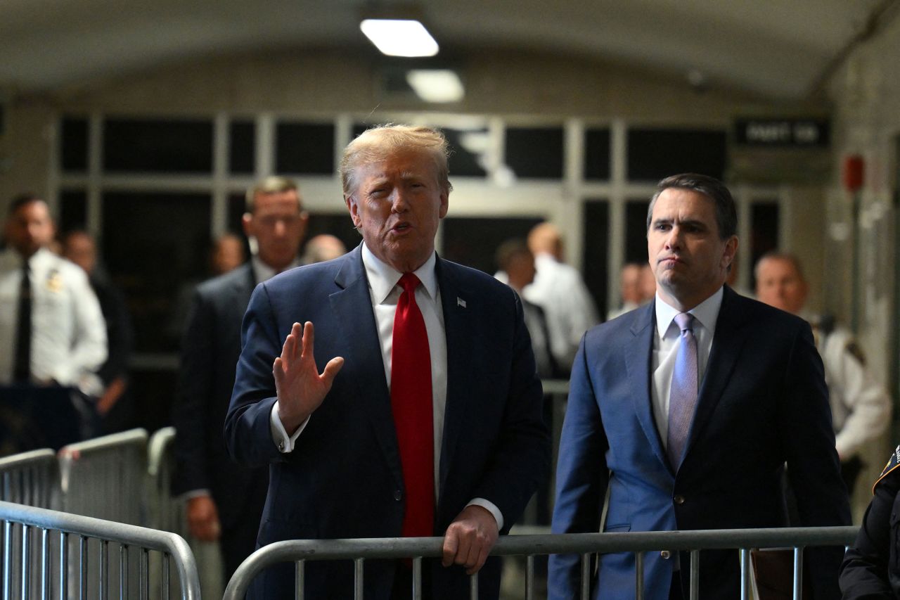 Former US President Donald Trump speaks to the press at Manhattan Criminal Court after a hearing in his case of paying hush money to cover up extramarital affairs in New York City on February 15, 2024. 