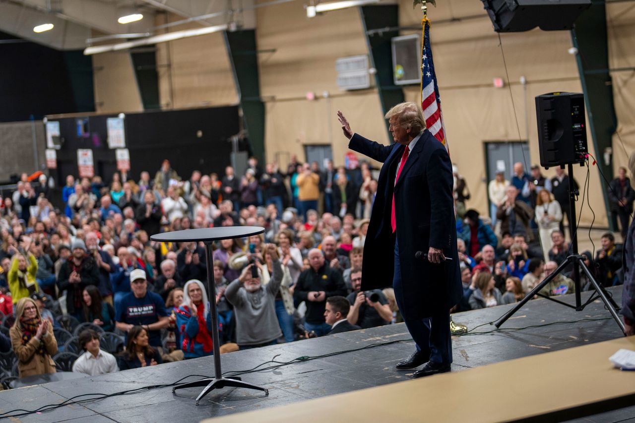 Former President Donald Trump visits a caucus site at the Horizon Event Center in Clive, Iowa, on Monday.