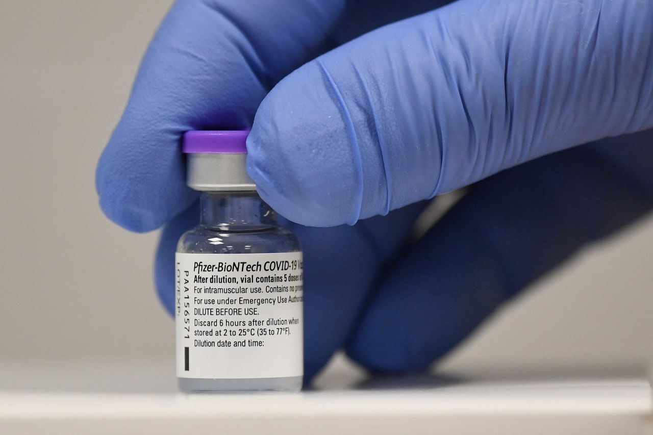 A phial of Pfizer-BioNTech Covid-19 vaccine is pictured at a vaccination center in Cardiff, Wales, on December 8.