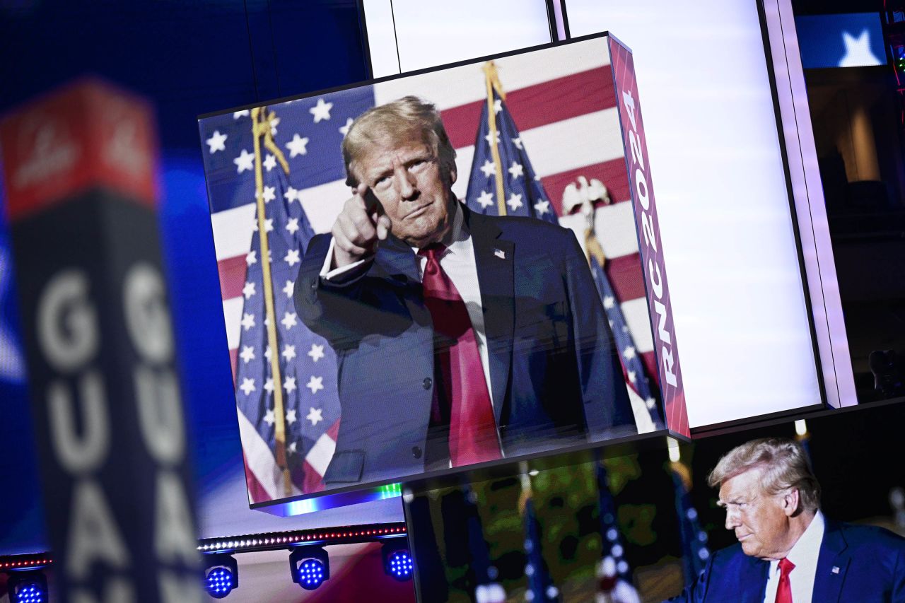 Images of Donald Trump appear on stage screens in the Fiserv Forum in Milwaukee, Wisconsin, on July 14, ahead of the Republican National Convention.