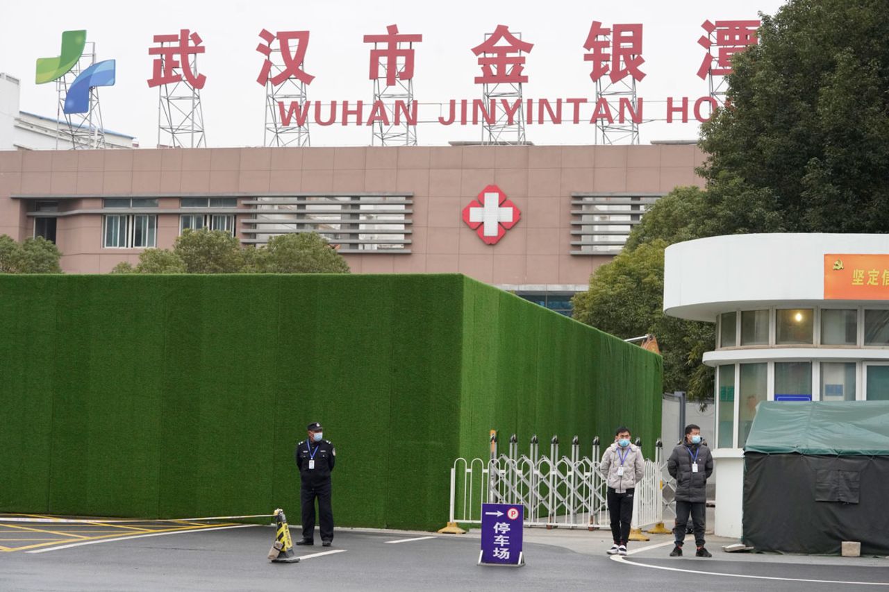 Security personnel guard an entrance to the Wuhan Jinyintan Hospital in China's Hubei province, where a team from the World Health Organization visited on January 30.