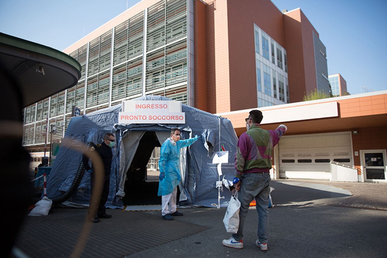 Health workers provide first Aird in front of Sant'Orsola Hospital  on Wednesday, March 18, in Bologna, Italy. 