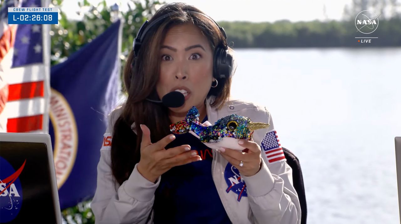 In this screen grab from video, NASA Communications Megan Cruz holds Calypso, the stuffed toy narwhal that is aboard Boeing's Starliner. 