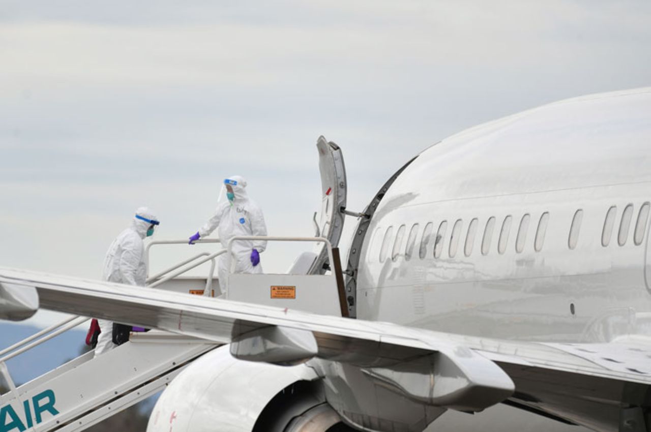 Medical Personnel help load passengers from the Grand Princess cruise ship onto airplanes at Oakland International Airport in Oakland, California on March 10.