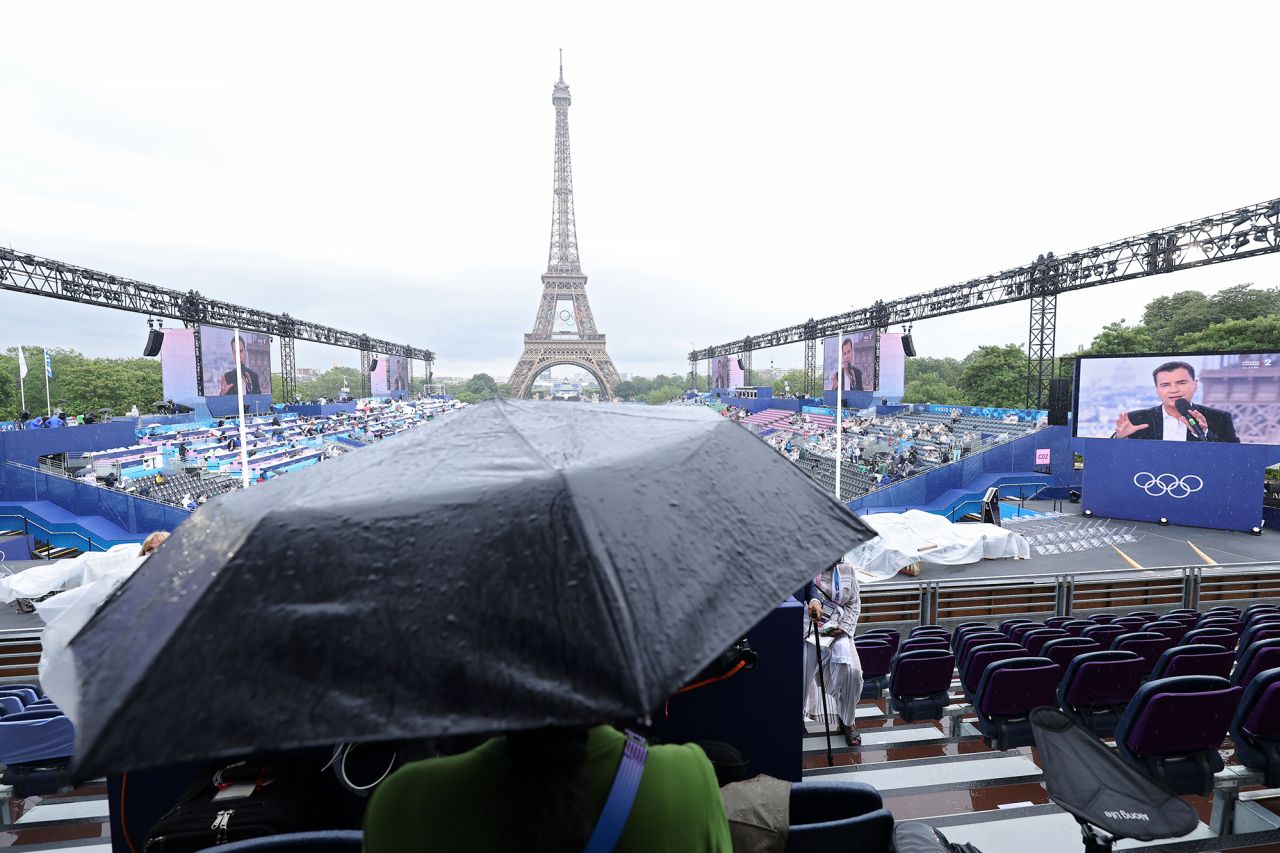 A detailed view of raindrops on an umbrella in front of the Eiffel Tower prior to the opening ceremony in Paris today.