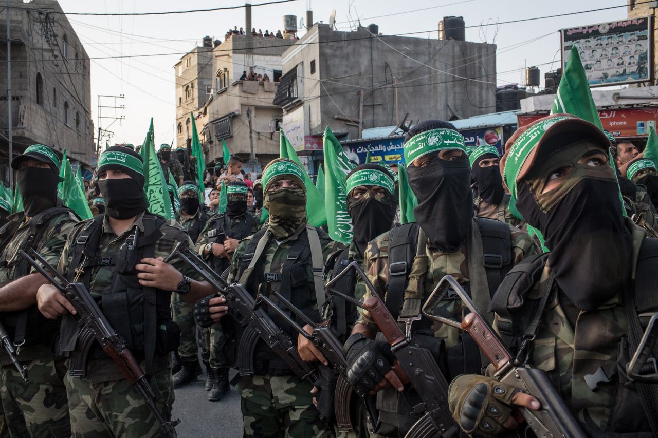 Palestinian Hamas militants are seen during a military show in the Bani Suheila district on July 20, 2017 in Gaza City, Gaza. 