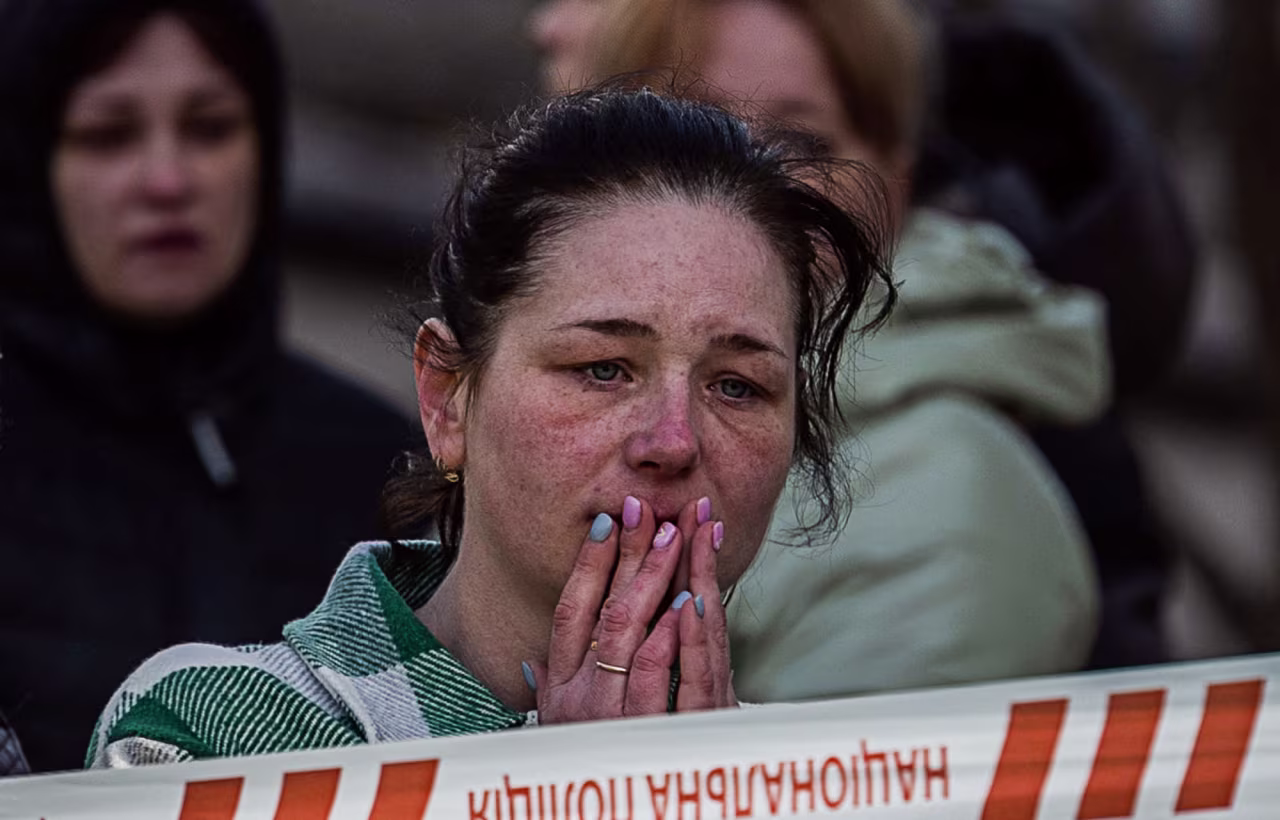 A local resident reacts near the site of a heavily damaged residential building hit by a Russian missile in the town of Uman, Cherkasy region, Ukraine, on April 28.