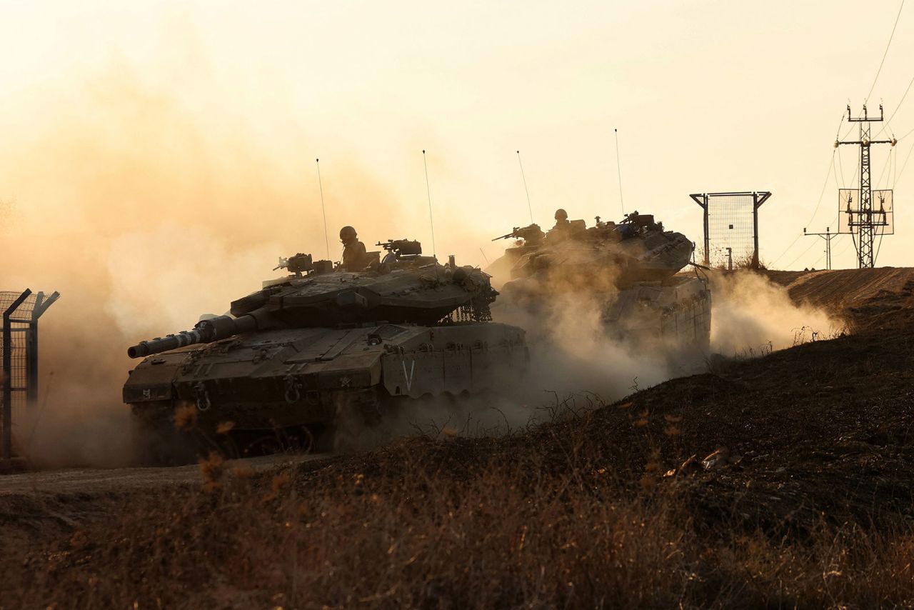 Israeli tanks move along the Israel-Gaza border on October 18. 