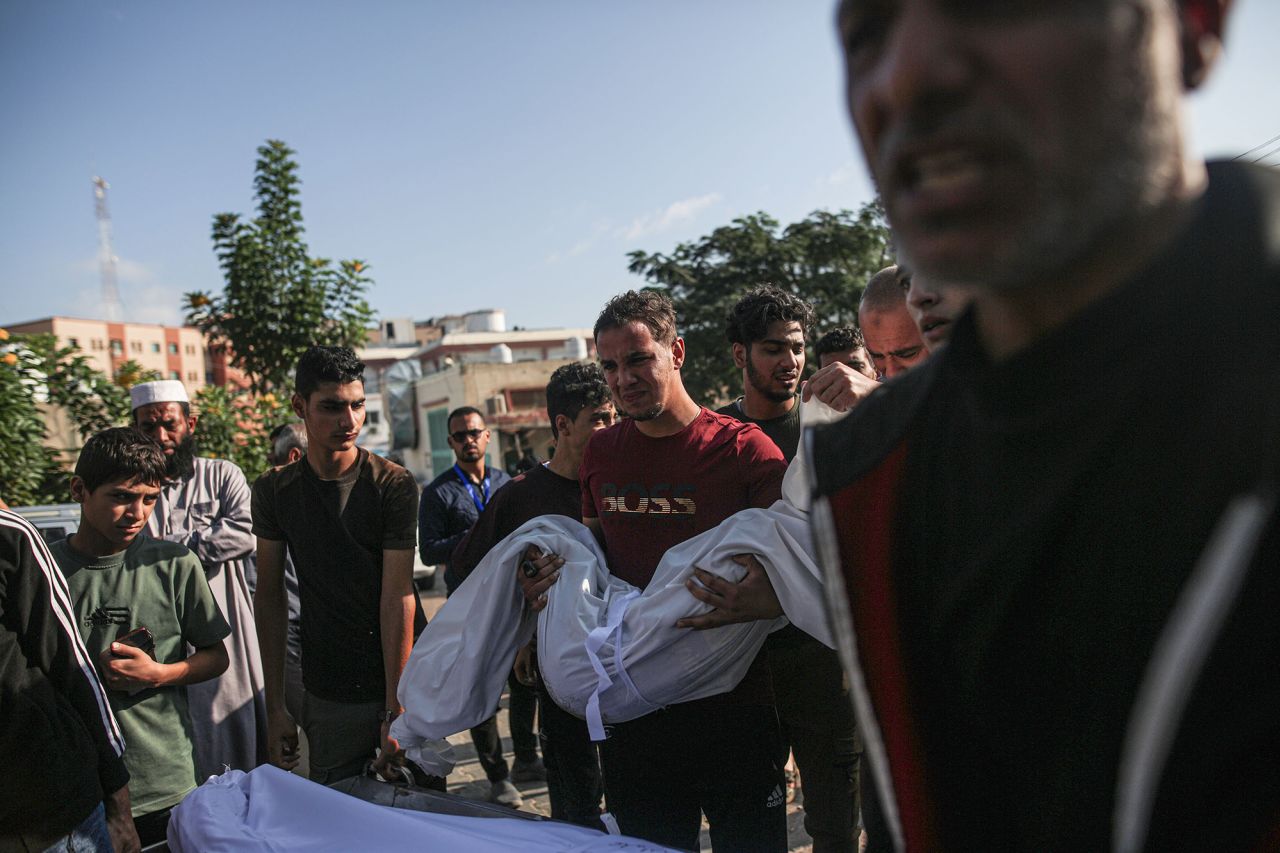 People attend the funeral ceremony of Palestinians who were killed in Israeli airstrikes in Khan Yunis, Gaza, on October 19.