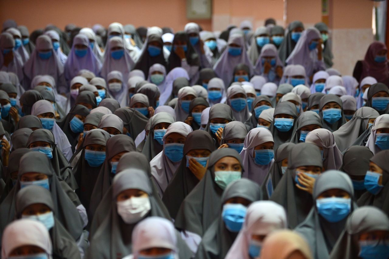 Students wear face masks during a ceremony at Attarkiah Islamic School in Narathiwat, Thailand on March 17. 