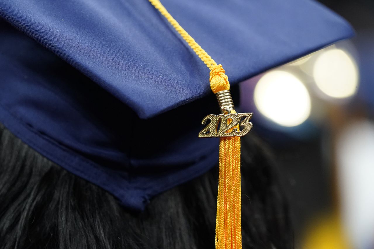  A tassel with 2023 on it rests on a graduation cap as students walk in a procession for Howard University's commencement in Washington, on May 13.