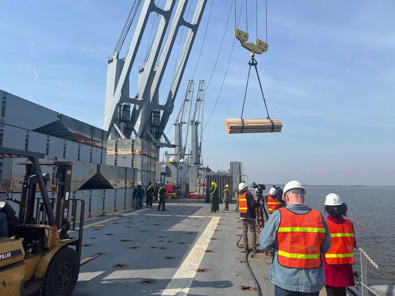 Service members load up the M/V Roy Benavidez