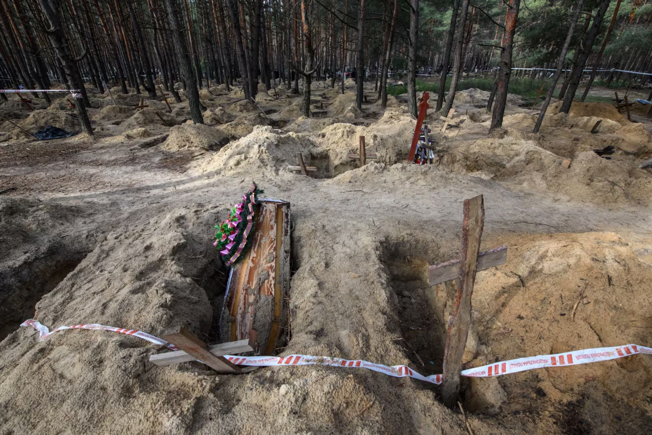 A mass burial site after exhumation in Izum, Ukraine, on September 30.