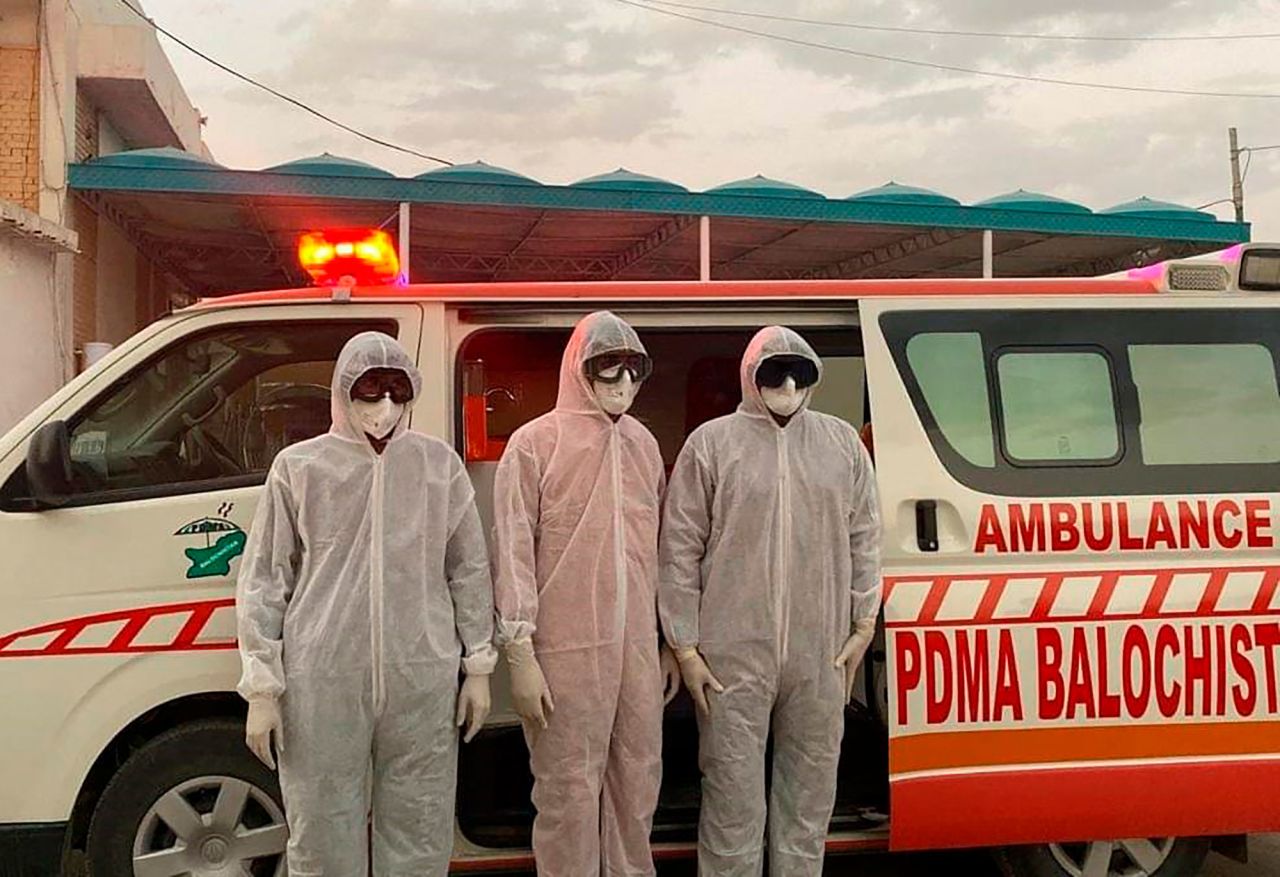 Medical staff stand at the Pakistan-Iran border in Taftan, Pakistan, which was closed due to the outbreak of coronavirus in neighboring Iran, on Tuesday, February 25.