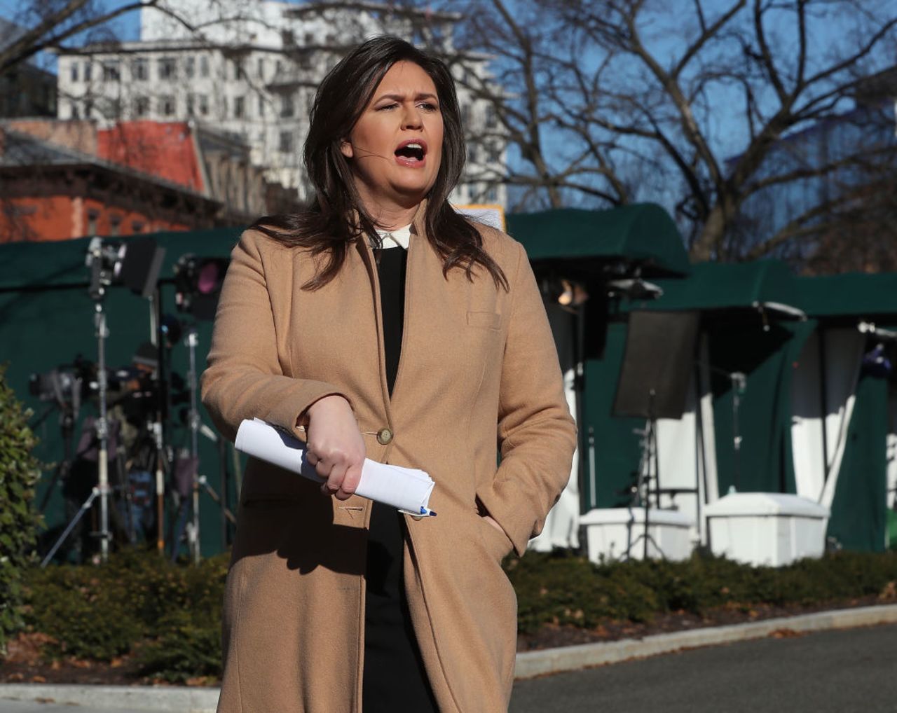 White House Press Secretary Sarah Huckabee Sanders speaks to the media in the White House driveway after appearing on a morning television show on Dec. 18, 2018 in Washington, DC.