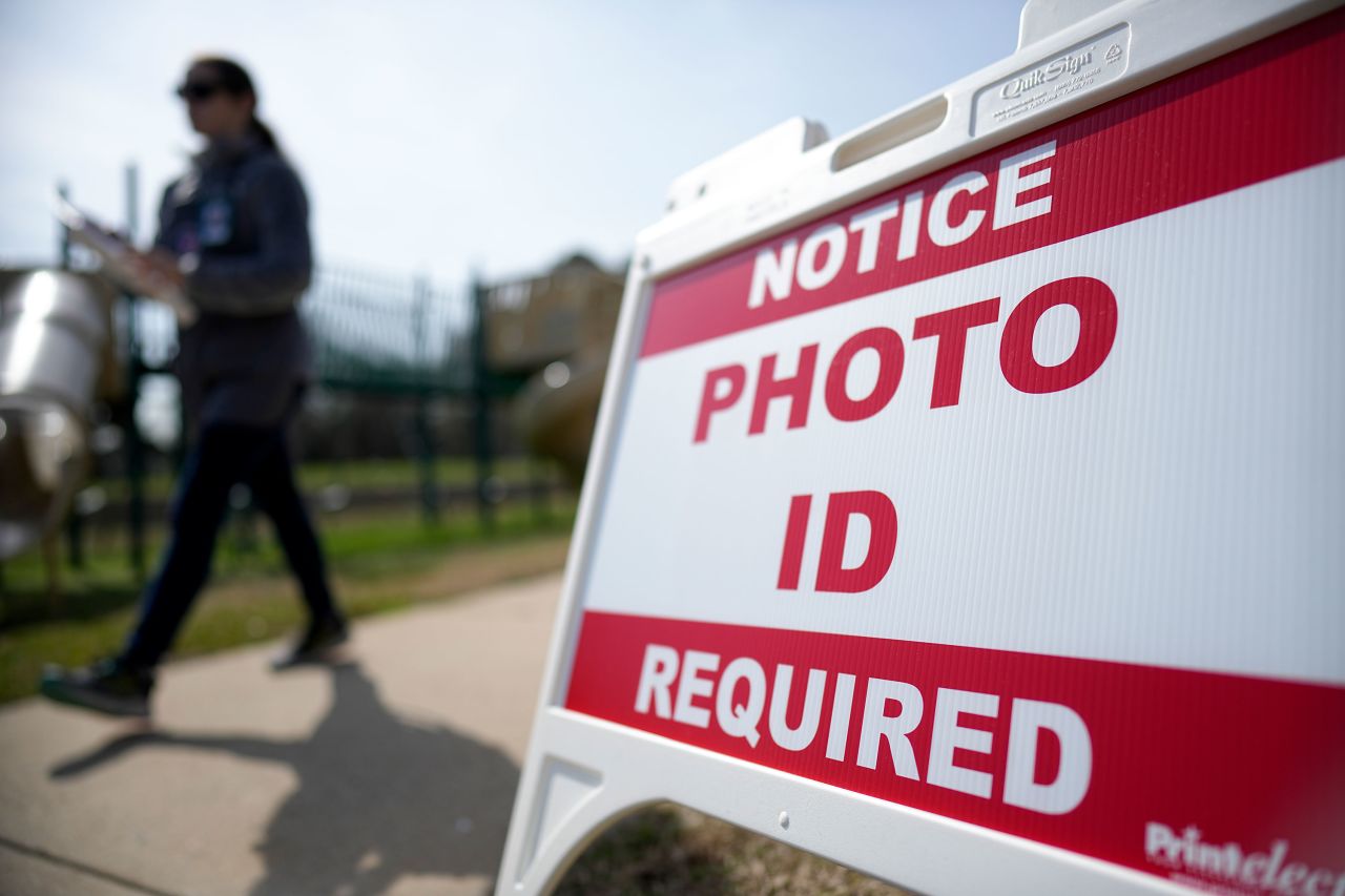 A voter walks past a sign at a polling location in Mount Holly, North Carolina, on Tuesday.