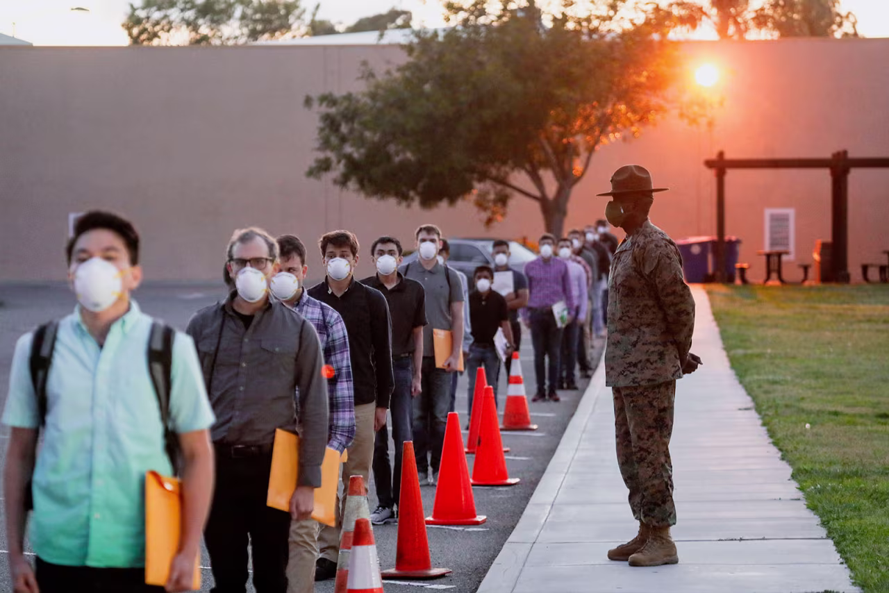 US Marine Corps recruits wait in line for health screenings at the Marine Corps Recruit Depot in San Diego, California.
